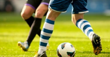 jogadores de futebol pernas