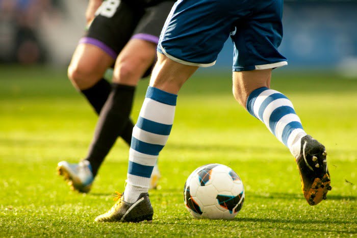 jogadores de futebol pernas