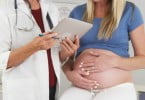grávida no médico Saúde Oral