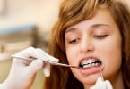 adolescente no dentista Saúde Oral