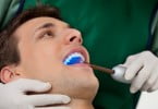 homem no dentista Saúde Oral